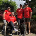 a family photo of patricia mark riley and brodie seger wearing red shirts that say end ALS