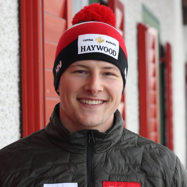 A portrait of Brodie Seger wearing a toque and alpine Canada jacket.