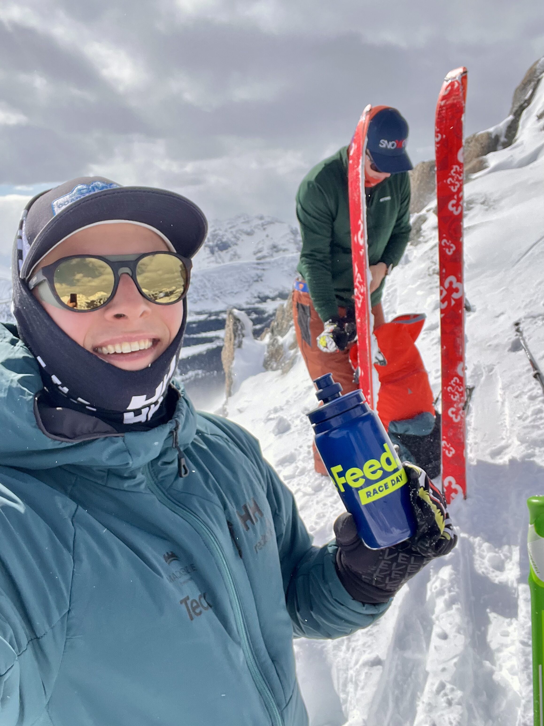 Taking a sip after a skin up the mountain