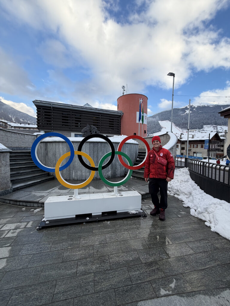 Riley, the rings, and the downhill slope in the background.